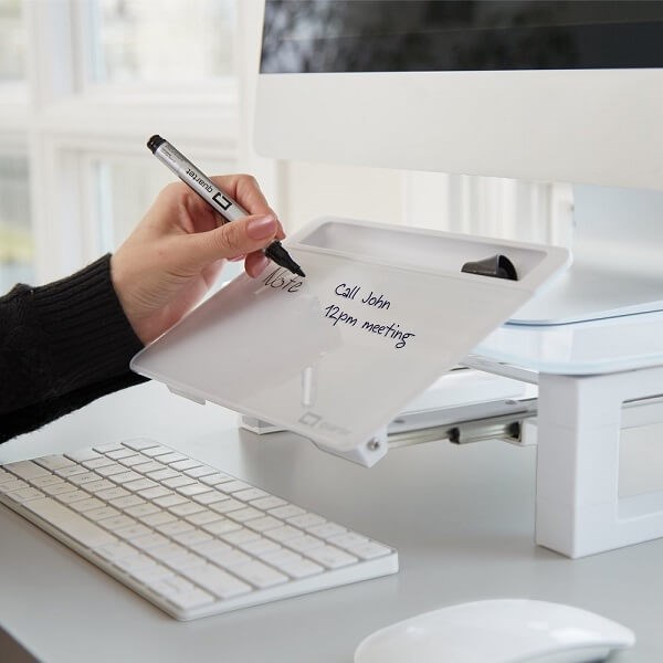 Person writing on Quartet Desktop Glass Monitor Riser