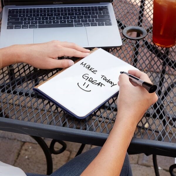 Person writing on Quartet Desktop Glass Portable Glass Pad 