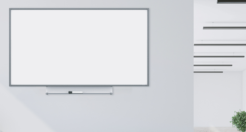 Whiteboard with marker tray on gray wall