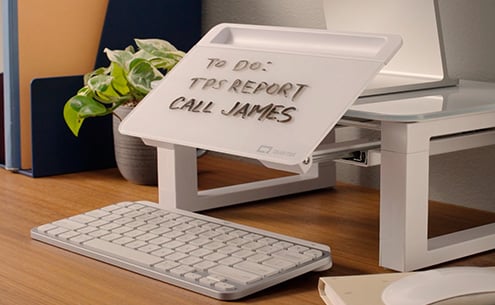 Desktop Glass Dry-Erase Monitor Riser with  to-do list written on it