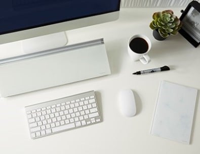 Desktop pad and easel being used in office